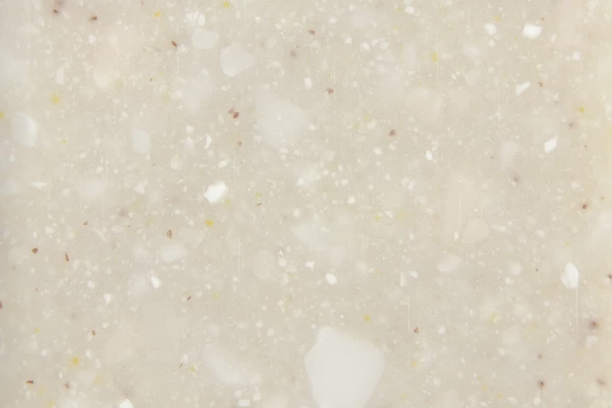 Recycled glass worktop finish in warm beige with subtle flecks