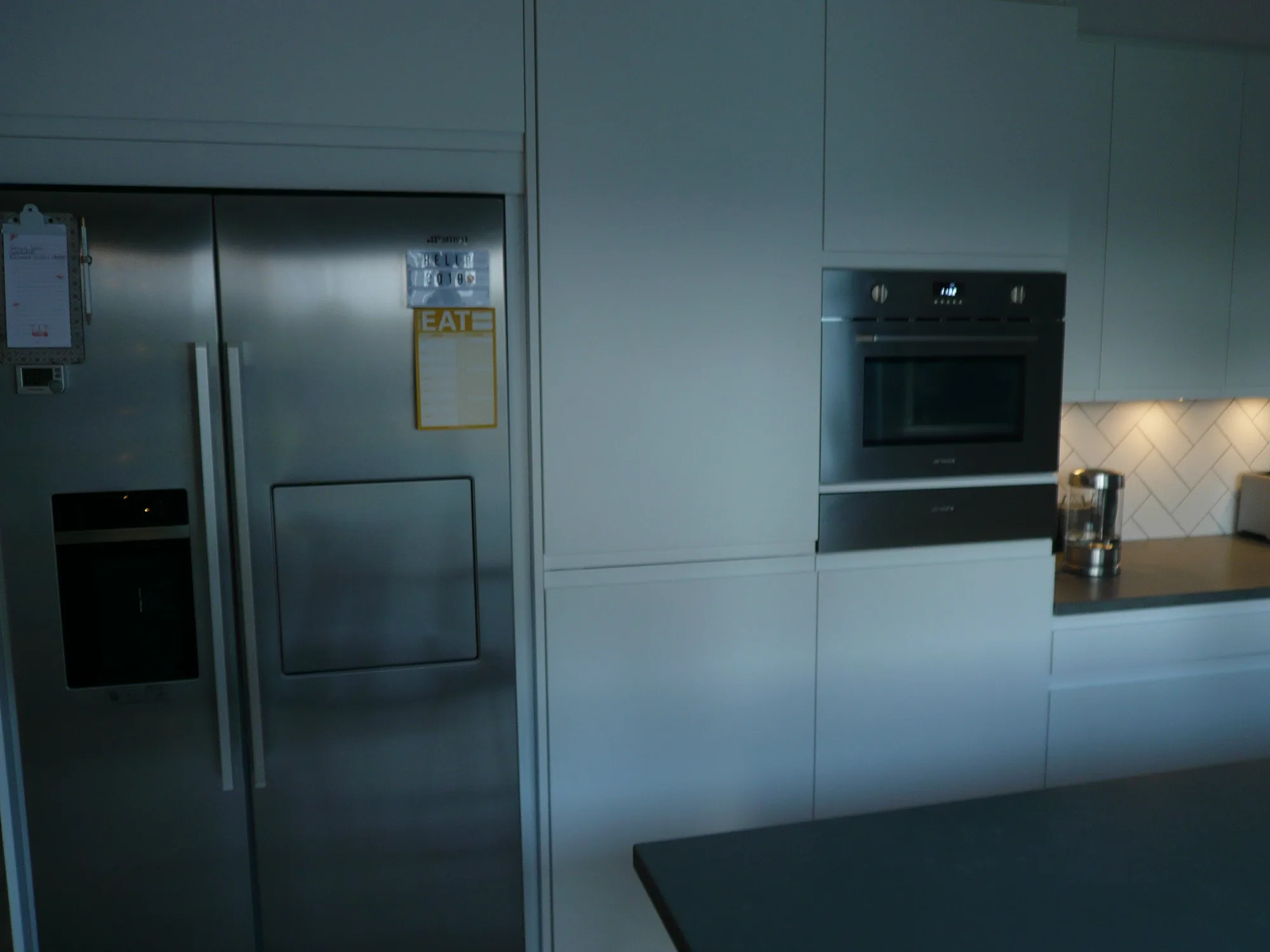 Glazed doors at the garden end of the Clydebank kitchen, with the grey worktop island in the foreground