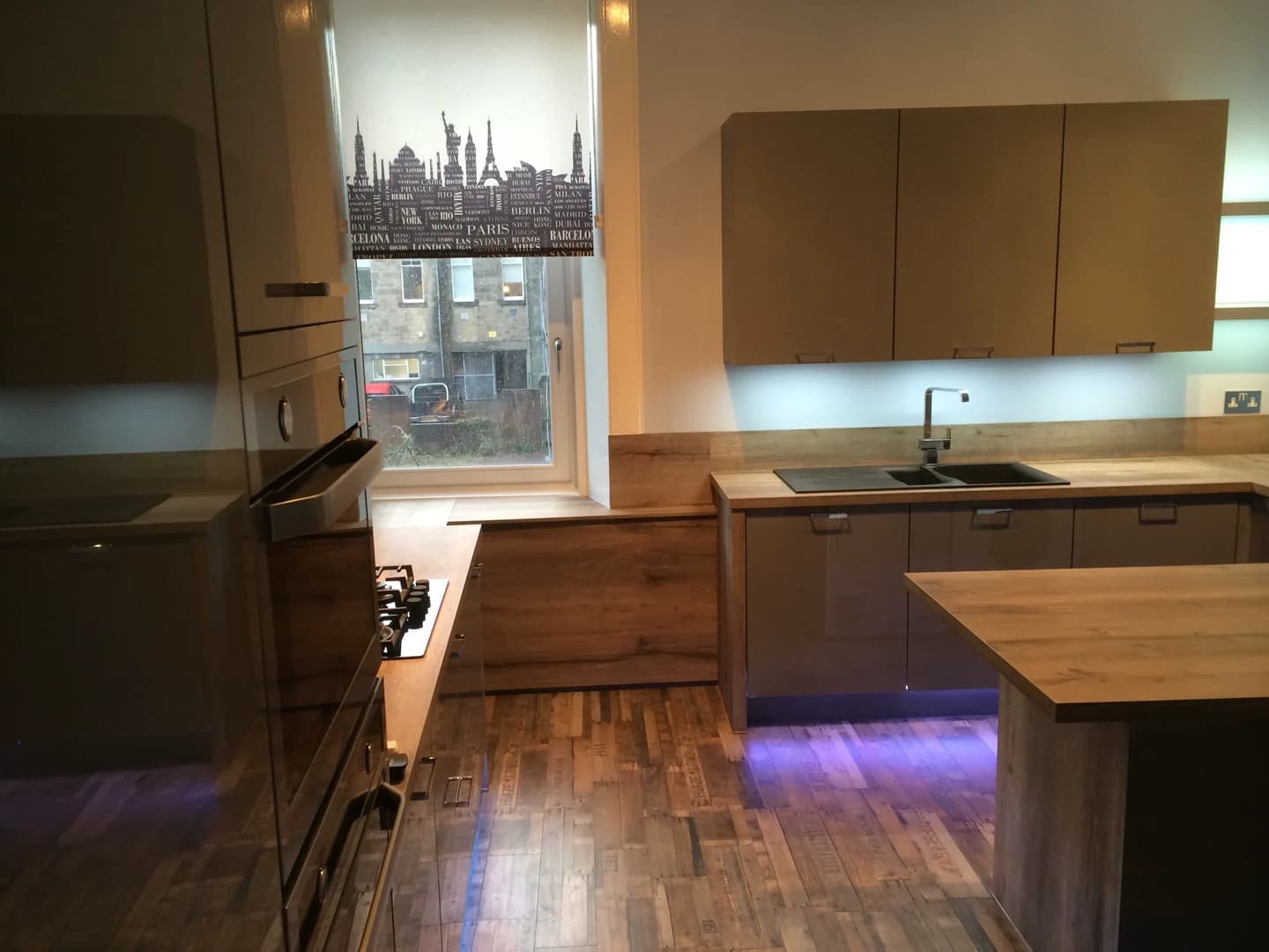 Completed kitchen showing our Vivo Gloss range with grey finish