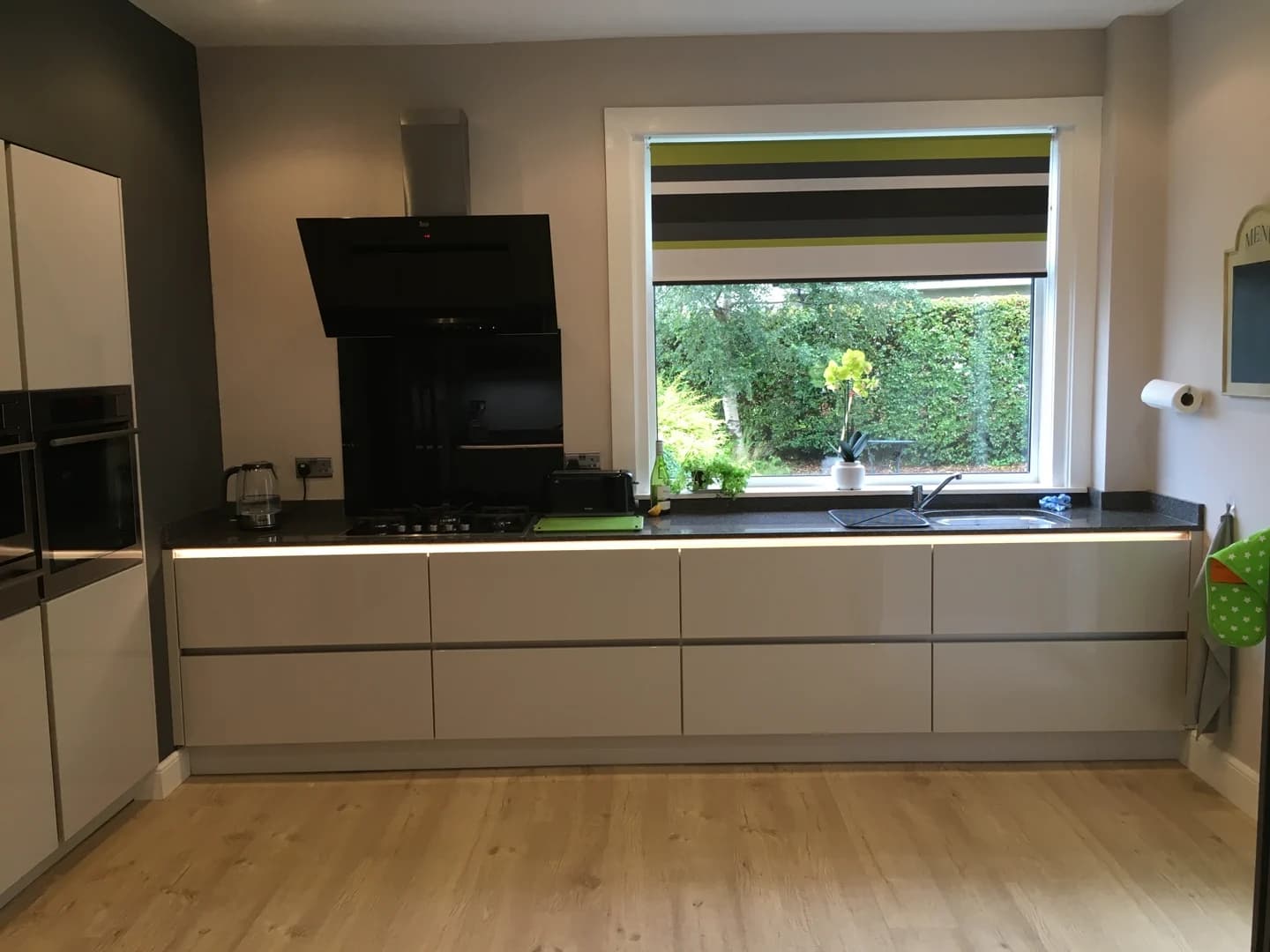 Completed kitchen showing our Vivo Gloass range with white finish