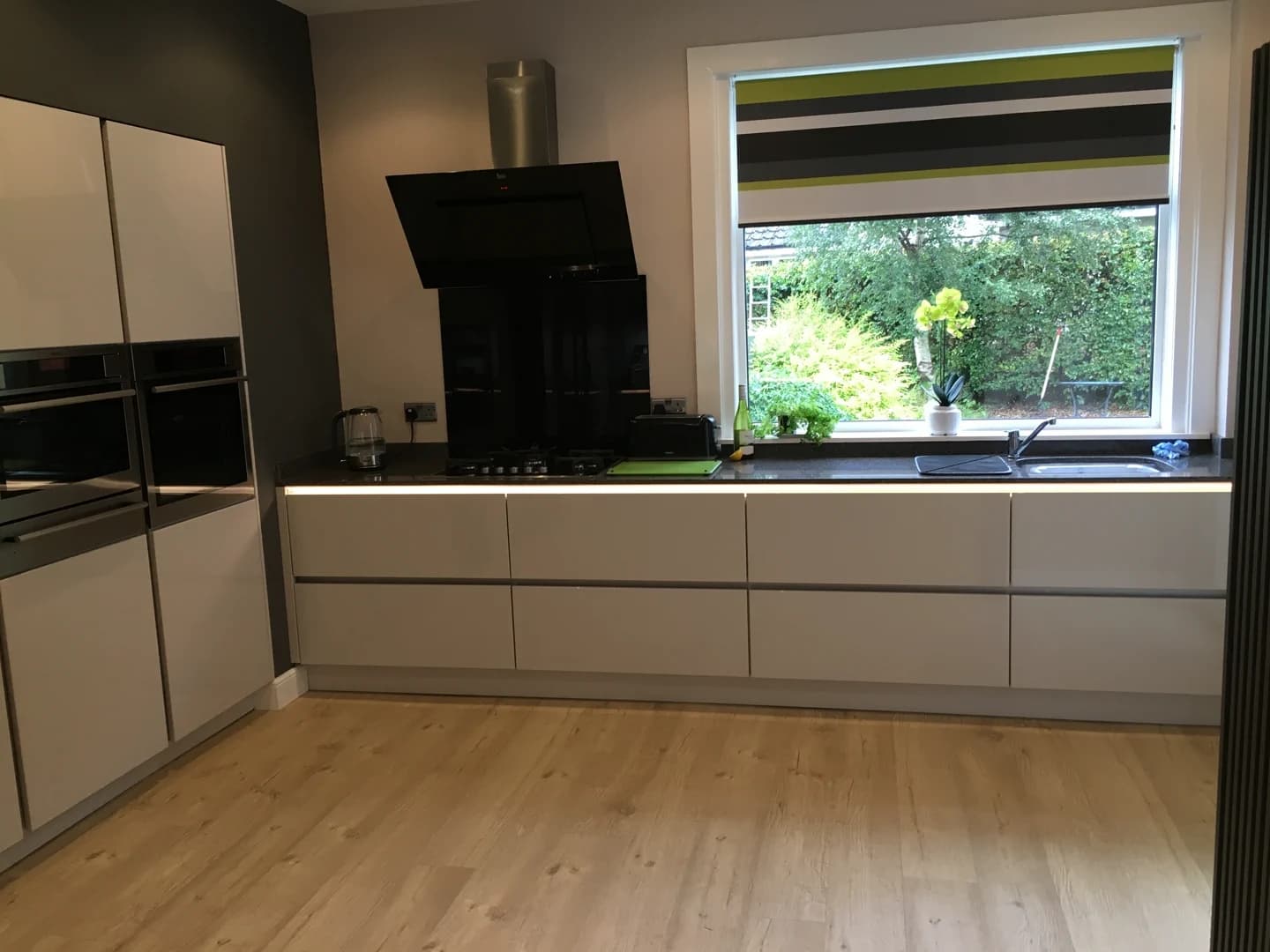 Completed kitchen showing our Vivo Gloass range with white finish