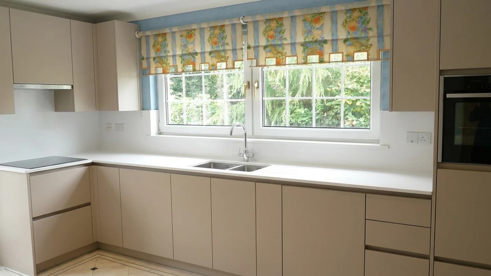 AI visualisation of the same kitchen with handleless doors in cashmere