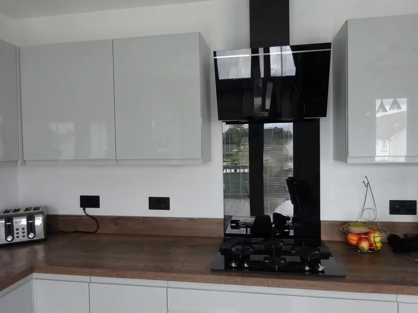 Completed kitchen showing Lucente Light Grey finish