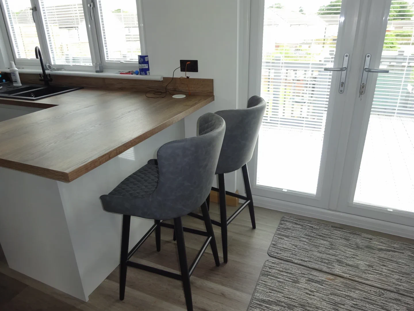 Completed kitchen showing Lucente Light Grey finish