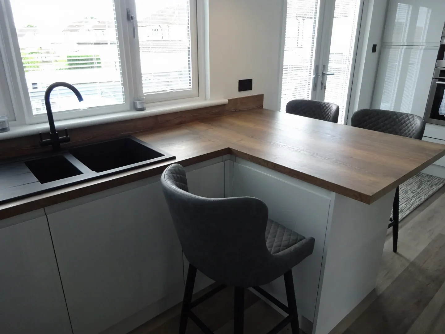 Completed kitchen showing Lucente Light Grey finish