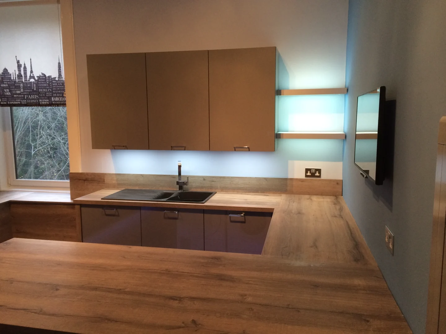 Completed kitchen showing our Vivo Gloass range with grey finish