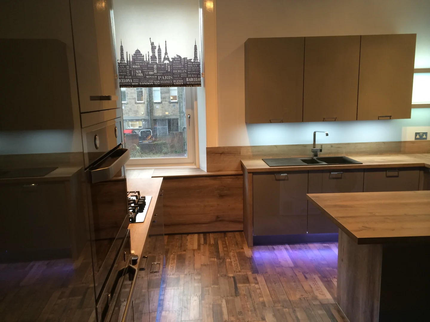 Completed kitchen showing our Vivo Gloass range with grey finish