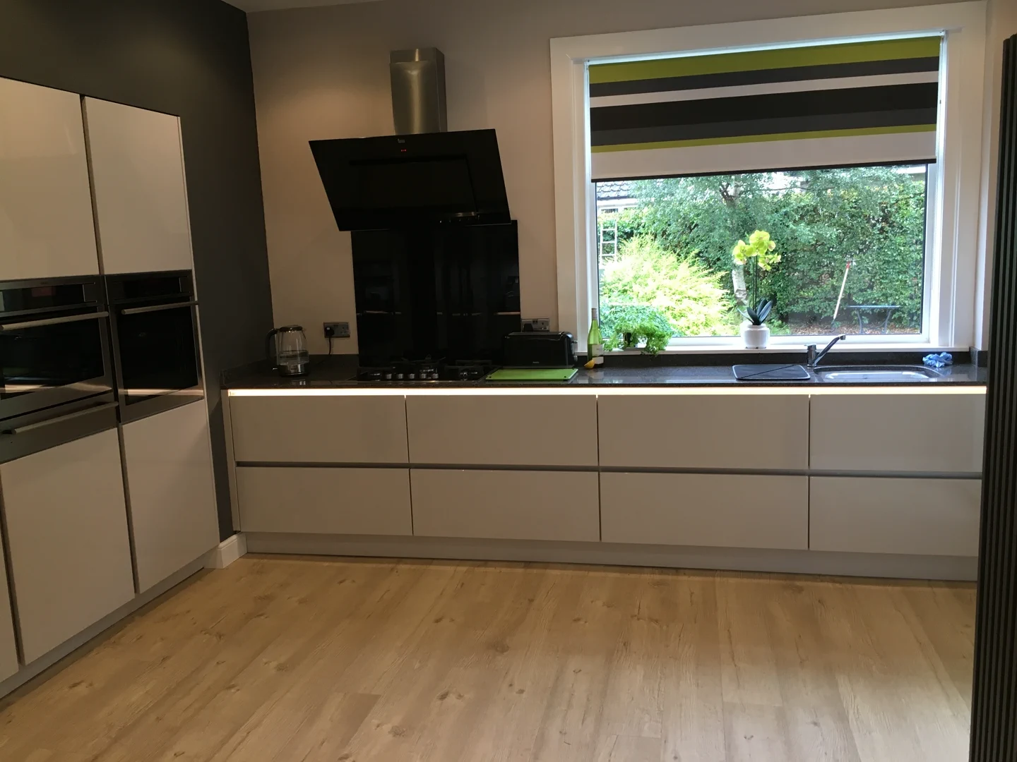 Completed kitchen showing our Vivo Gloass range with white finish