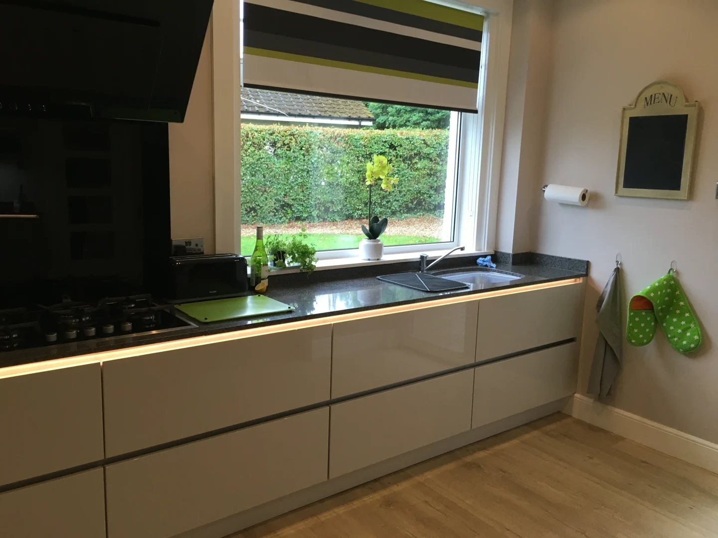 Completed kitchen showing our Vivo Gloass range with white finish